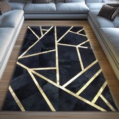 a black and gold rug in the middle of a living room