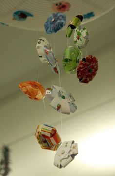 several different colored origami hanging from the ceiling