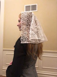 White d-veil. Fully covering, medium length. Clip sewn in. Great size for girls but works for adult women too! Hat Lace Veil, Lace Veil With Lace Trim For Ceremonies, Irish Lace Veil, White Lace Trim Veil For Ceremony, Mass Veil, Elegant White Scalloped Lace Veil, Catholic Veil, Veil Lace, Chapel Veil