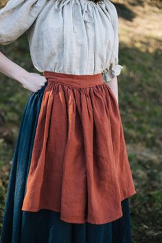 "A simple linen Apron will give texture and character when added to any costume! Made of 100% flax linen, with a gathered skirt, the total length of the waistband and ties measures 6' to ensure ample length to tie in the back (the apron body is 12\" wide and is included in the 6' measurement) Available in one size and in our standard linen colors - if you don't see the color you want- chat with us! *Please note that our 100% linen fabric comes from small dye batches, colors may vary due to scree Hobbit Fashion, Hobbit Costume, Medieval Peasant, Ren Faire Outfits, Simple Linen, Fair Outfits, Fest Outfits, Anne With An E, Medieval Costume