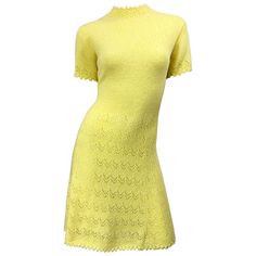 Tres chic ST. JOHN signature santana knit canary yellow short sleeve A-Line dress! Features the softest knit that stretches to fit. Hand crochet detail at the neck, sleeves and below the waist. Full metal zipper up the back with hook-and-eye closure. Great belted or alone. The perfect yellow color that matches any skin tone. Very well made, with heavy attention to detail. In great condition. Made in USA Approximately Size Medium / Large (tons of stretch) Measurements: 36-42 inch bust 32-40 inch Floral Print Gowns, Pleated Tops, Printed Gowns, Crochet Vintage, Yellow Short, Vintage Gowns, Canary Yellow, 60s Dress, Yellow Shorts