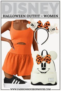 a woman in an orange dress and mickey mouse backpack