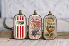 three small tin canisters sitting on top of a table