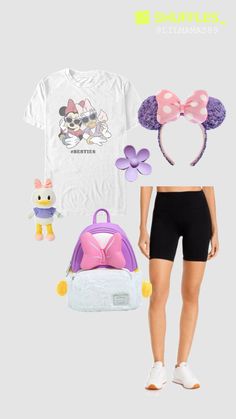 a woman wearing minnie mouse ears, shorts and t - shirt with other items in front of her