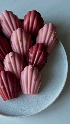 there are many pink candys on the plate