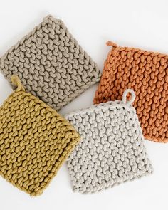 three knitted bags sitting next to each other