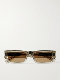 Narrow, rectangular frames are a trending style among celebrities and influencers. SAINT LAURENT Eyewear's pair has been made in Japan from transparent beige acetate with wide arms revealing logo-engraved metal wire cores. Sunglasses Logo Design Ideas, Celebrities With Glasses, Eyewear Logo, Fancy Glasses, Saint Laurent Sunglasses, Project Work, Silver Sunglasses, Diamond Girl, High Heel Rain Boots