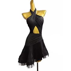 a mannequin wearing a black dress with yellow accents and fringes on it