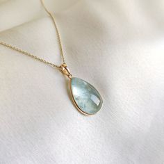 This stunning pendant is set in 14K Solid Yellow Gold with Natural Aquamarine with utmost precision. It is an unique gemstone pendant for nearly every occasion and is completely hassle-free jewelry. ITEM DETAILS * Gem: Aquamarine * Gem Size: 14X20mm * Gem Shape: Pear * Gem Weight: 12.65 carats * Gold Purity: 14KT  * Gold Weight: 0.60 gram * Total Weight of the Pendant: 3.13 gram The Gold purity is guaranteed and it comes with authentic 14KT gold hallmark. Since my items are handmade, they are absolutely nickel and lead free. CUSTOMIZATION * Gemstone customization is available and it can be substituted with a gem of your choice. Kindly message me for the same. PACKAGING * The Pendant comes with layers of safe and secure wrapping along with Free handmade jewelry box with every purchase. ➡️He Pisces And Aquarius, Aquamarine Gem, Rainbow Moonstone Necklace, Handmade Jewelry Box, Large Pendant Necklace, Glass Beads Jewelry, Aquamarine Pendant, Aquamarine Jewelry, March Birthstone