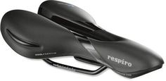 two black bicycle saddles sitting next to each other on a white surface with the words pennitto printed on them