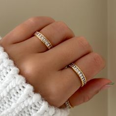 Baguette Eternity Ring features baguette crystals that perfectly hugs around the entire band. So whether you're looking at it from the top, down, left or right, it's going to sparkle back at you. Designed with a border, this band is very comfortable to wear. MATERIALS: Gold Plated, Brass Cubic Zirconia  Need some jewelry inspiration? Follow us on Instagram @statementGrey Cubic Zirconia Eternity Band With Baguette Diamonds As Gift, Baguette Cut Diamonds Eternity Band As Gift, Baguette Diamonds Eternity Band As Gift, Baguette Diamond Eternity Band Gift, Cubic Zirconia Baguette Rings For Gifts, Gift Baguette Diamonds Stackable Rings, Gift Stackable Baguette Diamond Rings, Baguette Rings For Gift, Baguette Cut Cubic Zirconia Stackable Rings As Gift