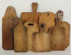 several wooden cutting boards with different shapes and sizes