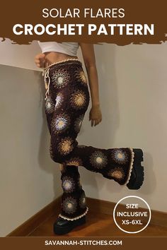 a woman standing on top of a wooden floor wearing crochet pants and boots