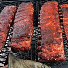 bbq ribs are being cooked on the grill