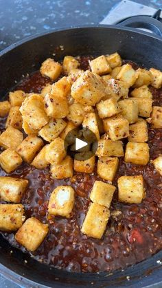 the food is being cooked in the pan on the stove top and ready to be eaten