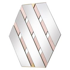 a mirror that is on top of a white surface with pink strips in the middle