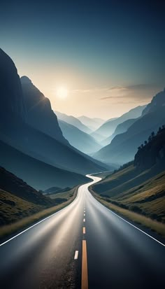 the sun is shining down on an empty road in the middle of mountains and valleys