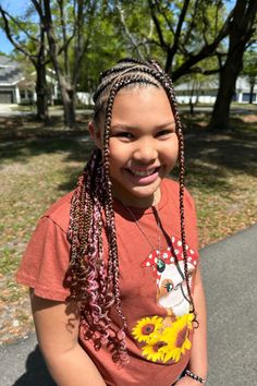 This fun hairstyle has many thin braids spaced evenly across the head with beads in the braids, showing a detailed pattern that shows both ability and personal style. The braids have hair of a natural color mixed with bits of bold purple and bright magenta extensions added in, contributing a playful splash of color that - Click to see more of Get Your Hair Game on Point with These 25 Stylish Snoopy Hairstyles and follow us for more hairstyle ideas. // Photo Credit: Instagram @jadathastylist Hair Game