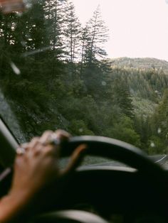 a person driving a car in the mountains