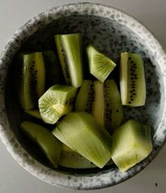 a bowl filled with sliced up pieces of fruit