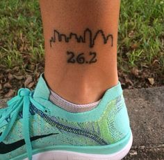 a woman's foot with a small tattoo on her left ankle that reads, mom 26 2