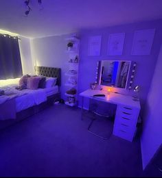 a bedroom with purple lighting in the corner