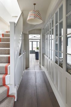 the hallway is clean and ready for us to use as an entrance way in this home