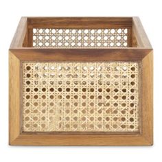 a wooden box that has holes in the front and sides, with an intricate design on it