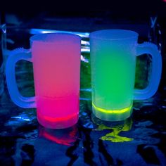 two glowing mugs sitting next to each other