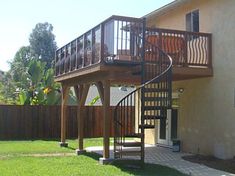 an outside view of a house with a spiral staircase