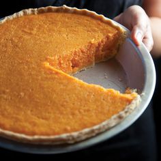 a person holding a pie in their hands