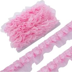 three pieces of pink ruffled fabric on top of each other and one piece of white tissue