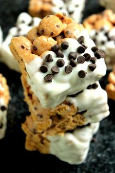 chocolate chip cookies and marshmallows are stacked on top of each other with white frosting