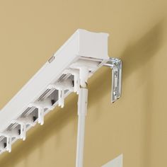 an image of a wall mounted electrical device with the words fix outside mount vertical blind headrail