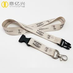 a lanyard strap with the words library on it and a metal hook attached to it