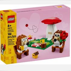 a lego box with an image of two sheeps in front of a mushroom house