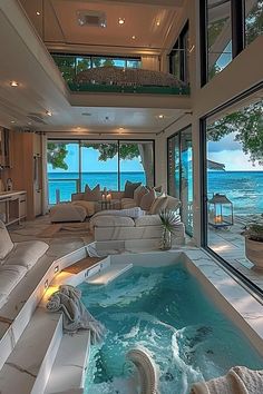 a living room with a large jacuzzi tub next to the ocean