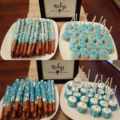 blue and white desserts displayed on plates with wooden sticks sticking out of them in front of an ice box