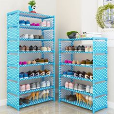 two blue shelving racks with shoes on them