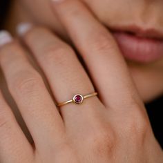 Ruby Ring 14K Gold Dainty Stacking Simple Red Stone Bezel Modern July Birthstone GR00218 A modern and timeless 14K gold ring with a natural Ruby gemstone. A perfect gold ring for women, stacking and minimalist that adds glam to every outfit. 100% handcrafted with love! ● Metal: 14K solid gold ● Gemstone: Natural Ruby ● Stone Diameter: 3.3mm R I N G ∙ S I Z I N G For General Reference: ● we use standard US Ring Sizing ● an average women's ring finger is size 6-7 ● each ring is custom made upon or Ruby Dainty Ring, Simple Ruby Rings, Red Stone Ring Women, Ruby Gold Rings For Women, Ruby Rings Women, Ruby Ring Simple, Engagement Ring With Ruby, Ring With Red Stone, Gold Ring With Ruby