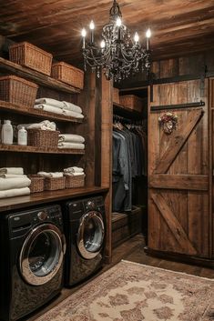 a washer and dryer in a room with wooden walls, chandelier and open closet doors