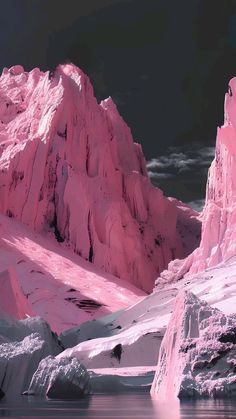 the mountains are covered in snow and icebergs at night, with bright pink lights shining on them