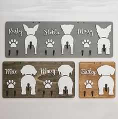 three wooden signs with dogs and names on them