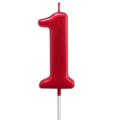 a red candle that is on top of a white stick with the number one on it