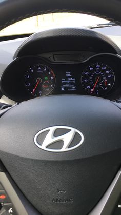 the dashboard of a car with gauges and speedometers