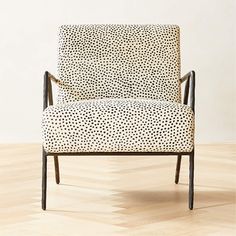 a black and white chair with spots on it