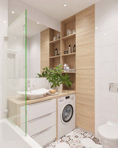 a washer and dryer in a bathroom next to a toilet with wooden shelves