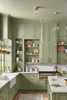 kitchen cabinets, color trends, sage green, home decorating Green Kitchen Cupboards Sage, Sage Green Pantry Shelves, Antique Green Cabinets, Large Green Kitchen, Pistachio Green Kitchen Cabinets, Best Green Color For Kitchen Cabinets, Soft Fern Kitchen Cabinets, Saybrook Sage Kitchen Cabinets, Green Kitchen Color Schemes