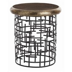 a metal and wood side table with an intricate design on the top, against a white background