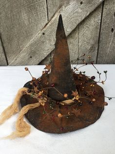 an old witches hat is sitting on a table